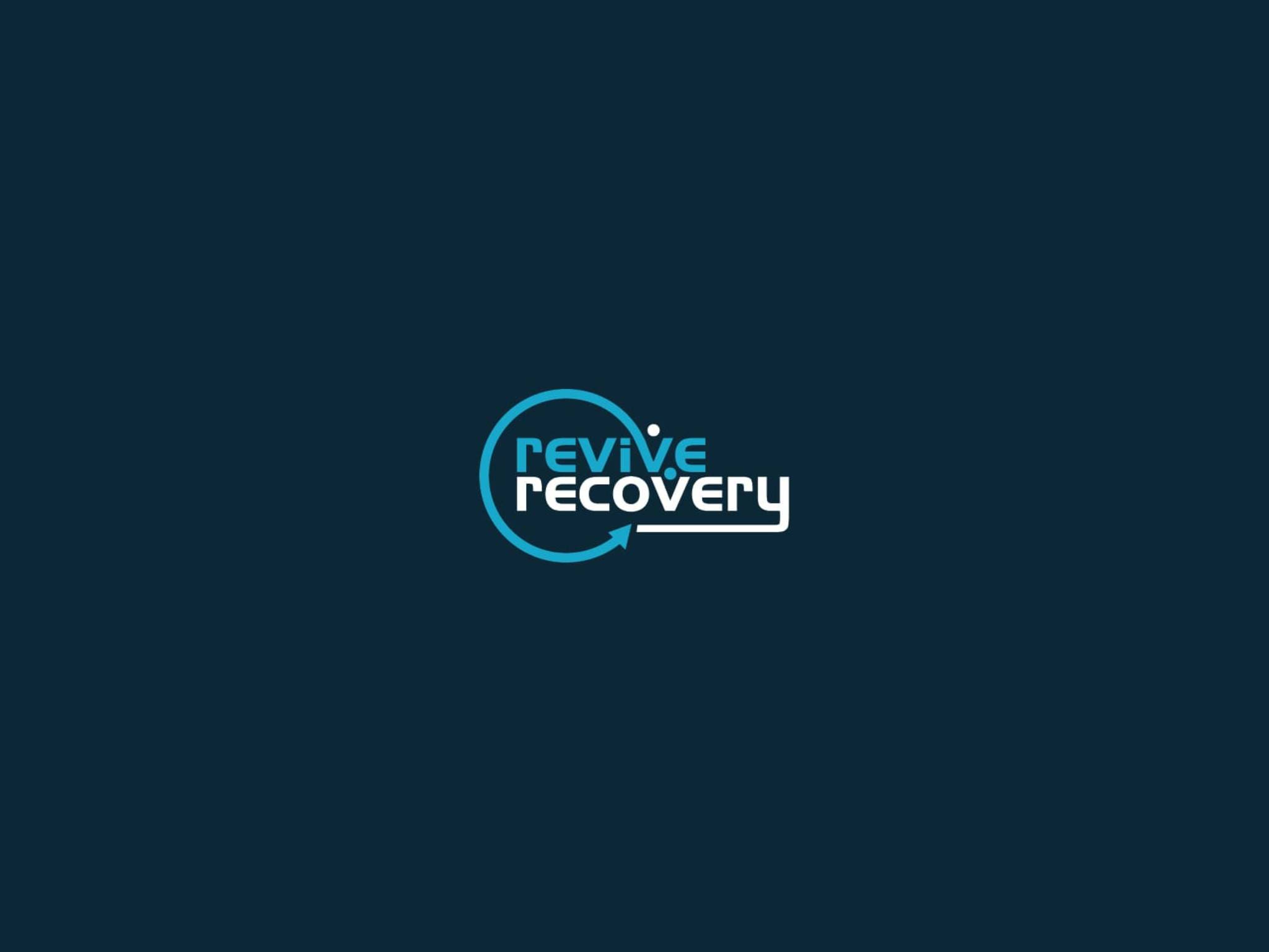 A blue and white logo for revive recovery